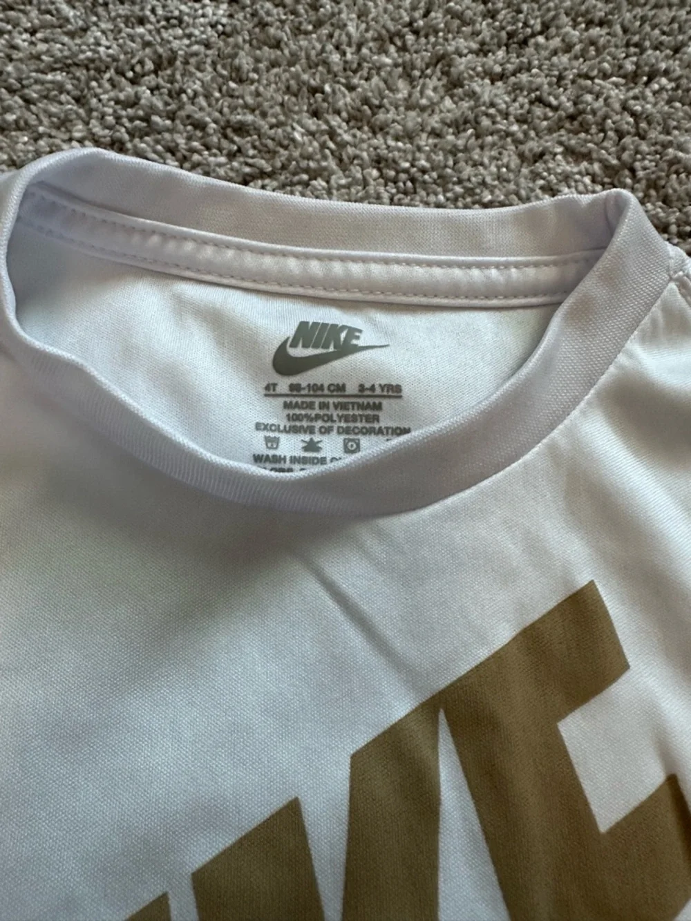 Nike White Kids Tee with Gold Swoosh Logo